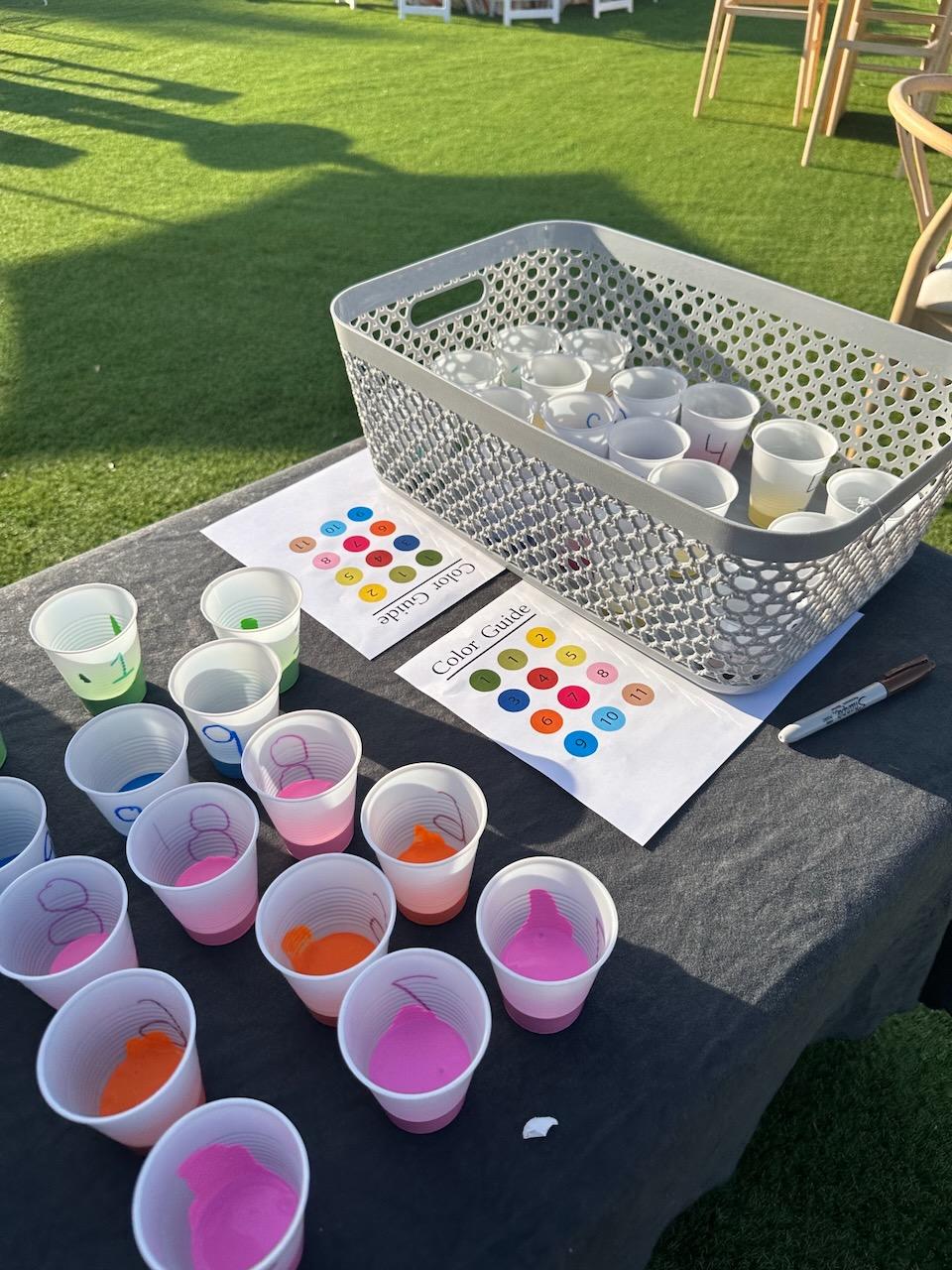 Kids color in a large color by number mural